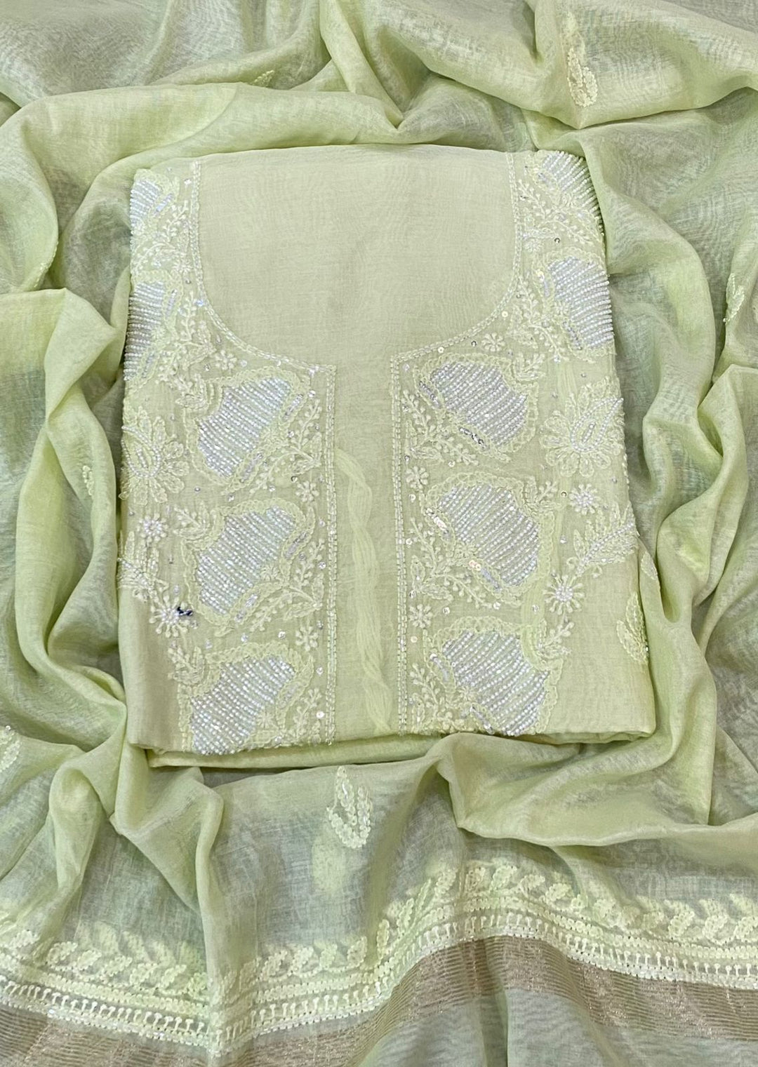 Light yellow Color Pure Mul Mul Chikankari and pearl cutdana Work Unstitched Suit