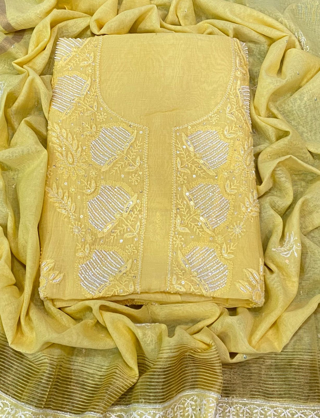 Yellow Color Pure Mul Mul Chikankari and pearl cutdana Work Unstitched Suit